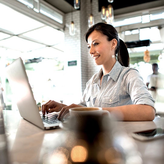 woman typing in a computer