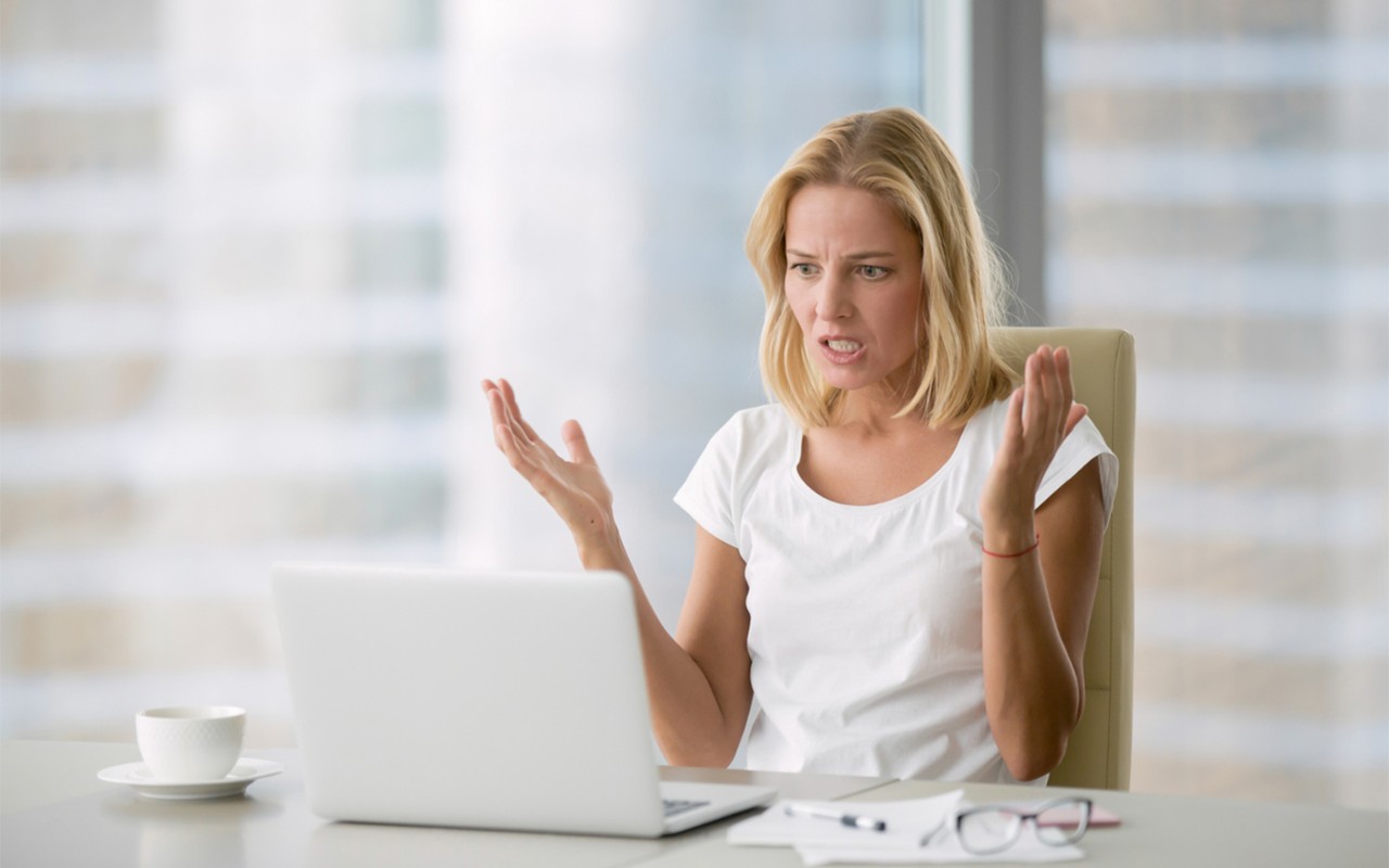 close up of hand pointing at tablet